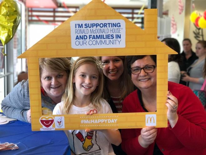 Jackie Raymond (far left) and Donna Bilodeau (far right) “work” at McDonald’s for McHappy Day
